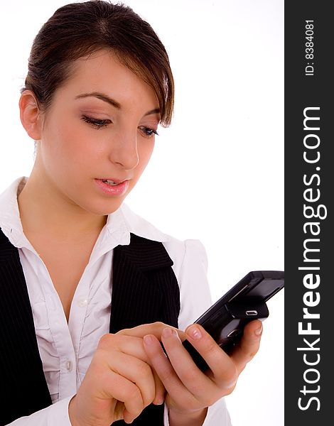 Front view of female executive using cellphone against white background