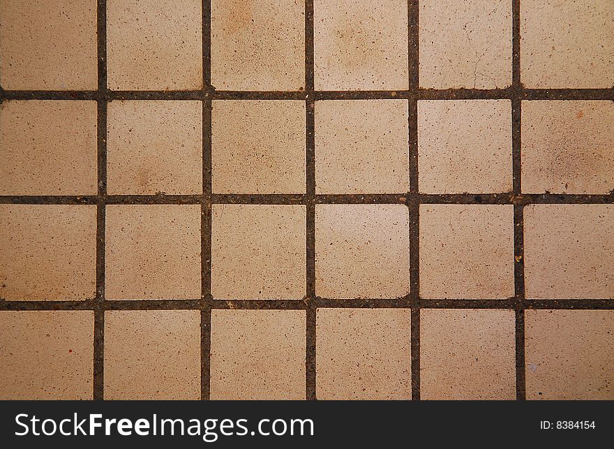 Old square tiles texture background close up. Old square tiles texture background close up