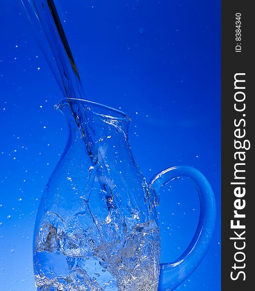 Glass with Splashing water. Coolness Drink