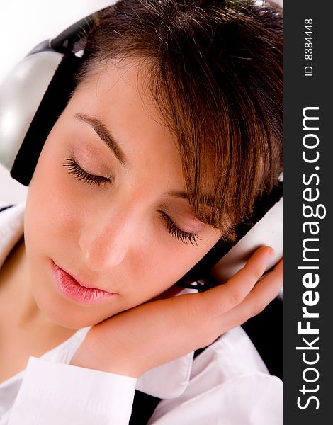 Closeup of businesswoman tuned to music