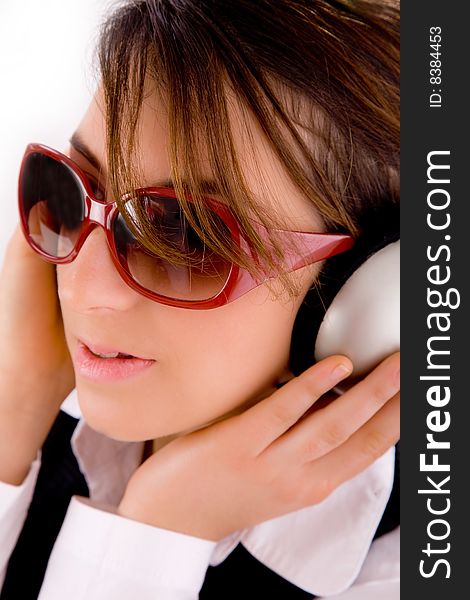 Closeup of young professional listening to music