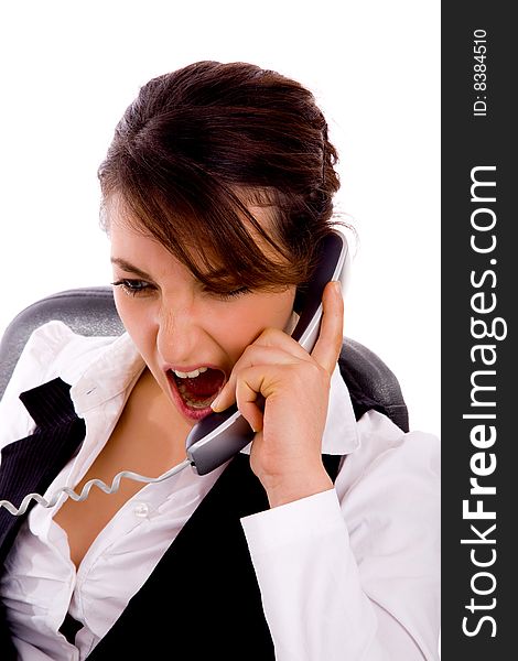 Front view of angry young businesswoman on call against white background