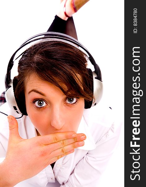 Front pose of amazed woman listening to music against white background
