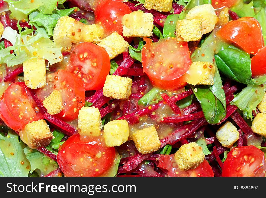 Texture of green salad with tomatoes and croutons. Texture of green salad with tomatoes and croutons