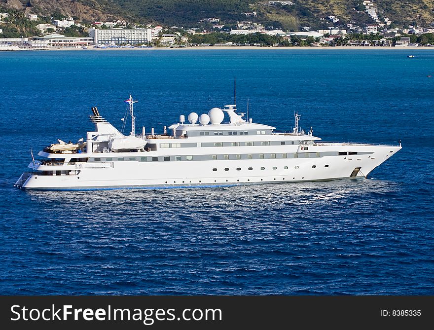 Large White Yacht In Blue Bay