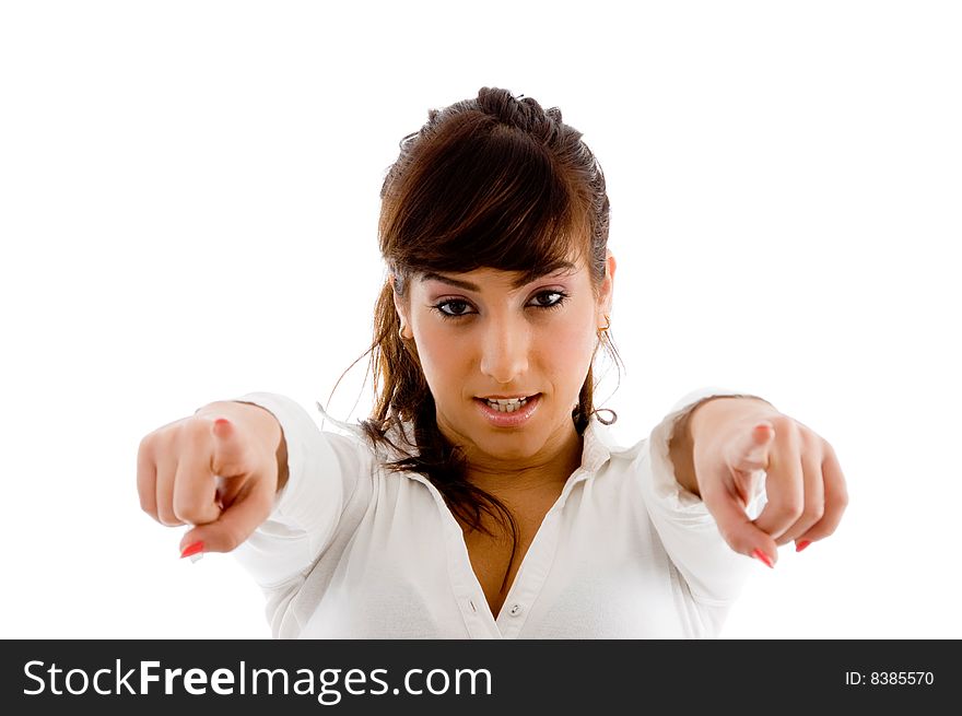 Portrait of young pointing businesswoman against white background