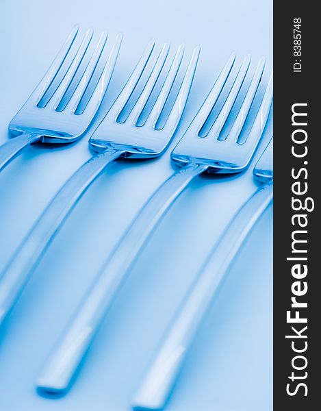 Set of forks with blue toning