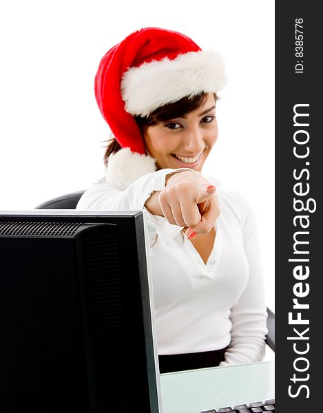 Front view of smiling christmas woman pointing on an isolated background