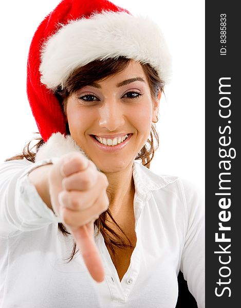 Front view of smiling christmas female with thumbs down on an isolated white background