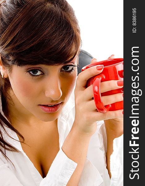 Front view of woman holding mug on an isolated white background