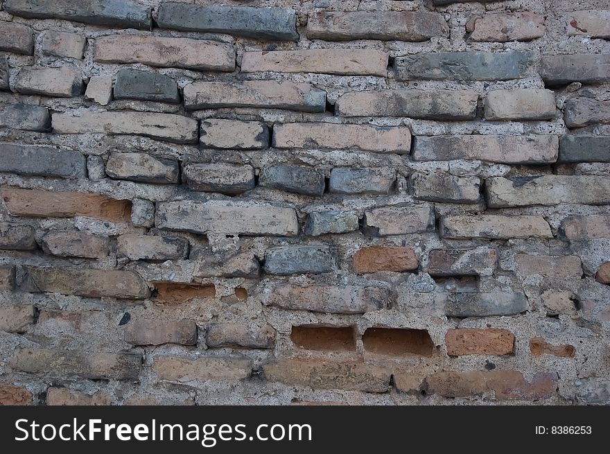 Old grey brick wall background