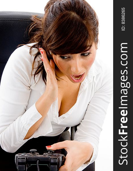 Front view of shocked woman with remote on an isolated white background