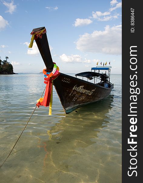 Traditional Thai boat on water