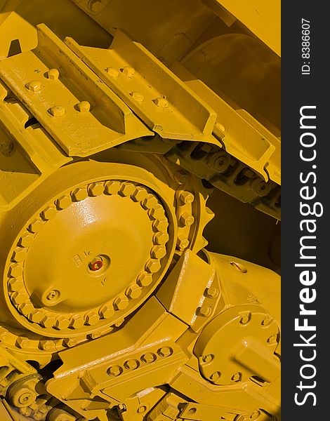 Machinery series: yellow painted track of heavy bulldozer