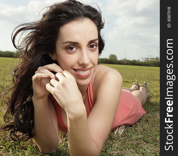 Woman Laying On The Grass