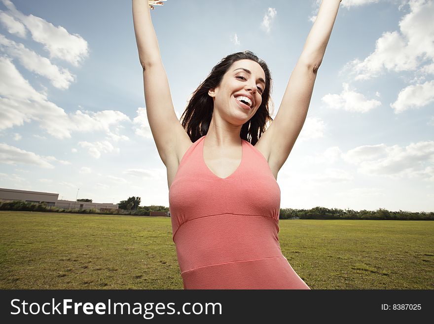 Beautiful woman in a nature scene expressing happiness. Beautiful woman in a nature scene expressing happiness