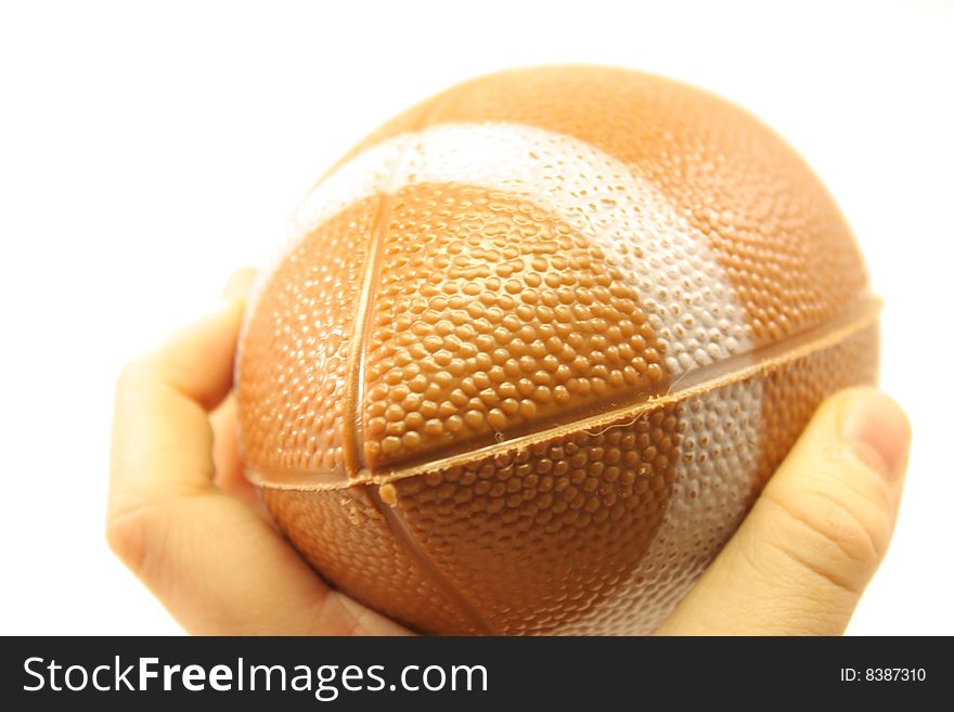 A close up of a child throwing a small football. A close up of a child throwing a small football.