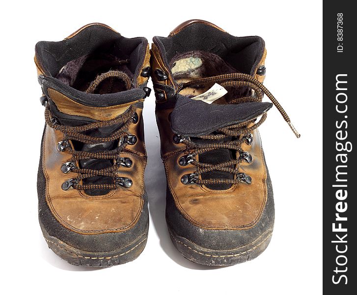 Pair of worn boots isolated on white