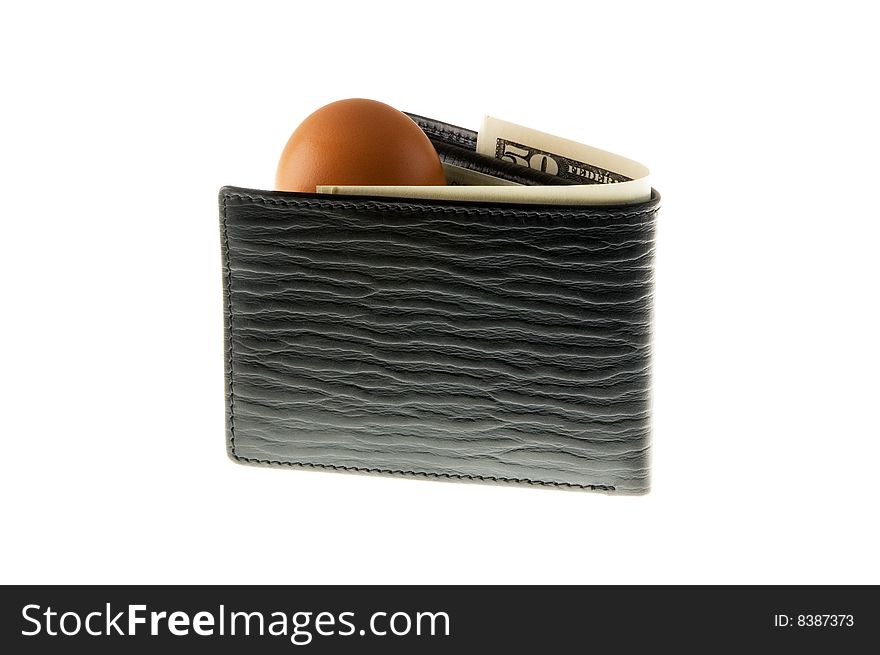 Easter egg hidden in black wallet with banknotes. Easter egg hidden in black wallet with banknotes