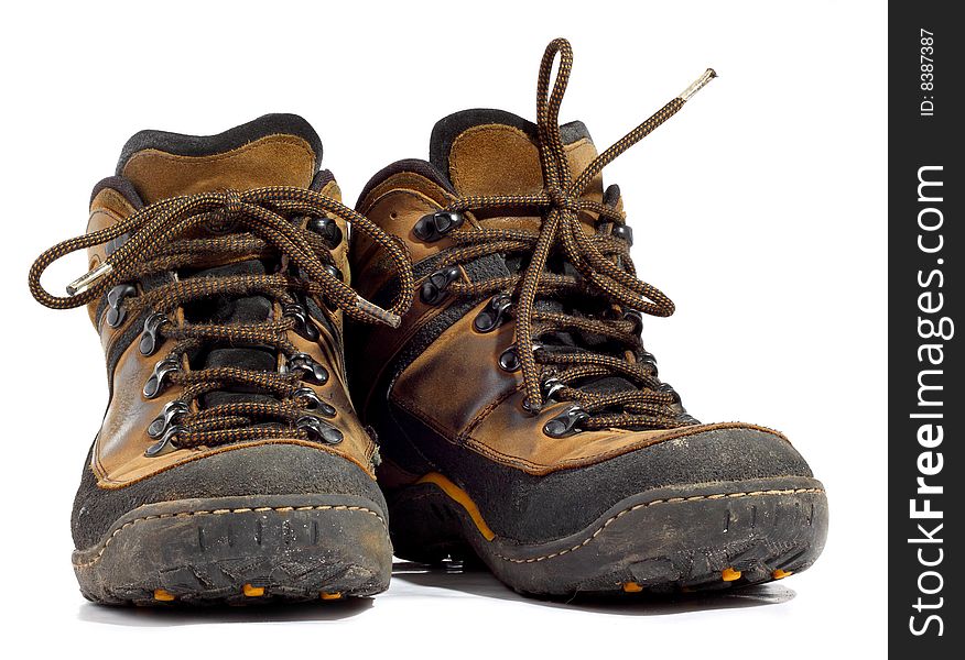 Pair of worn boots isolated on white