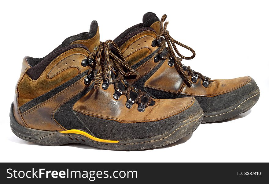 Pair of worn boots isolated on white