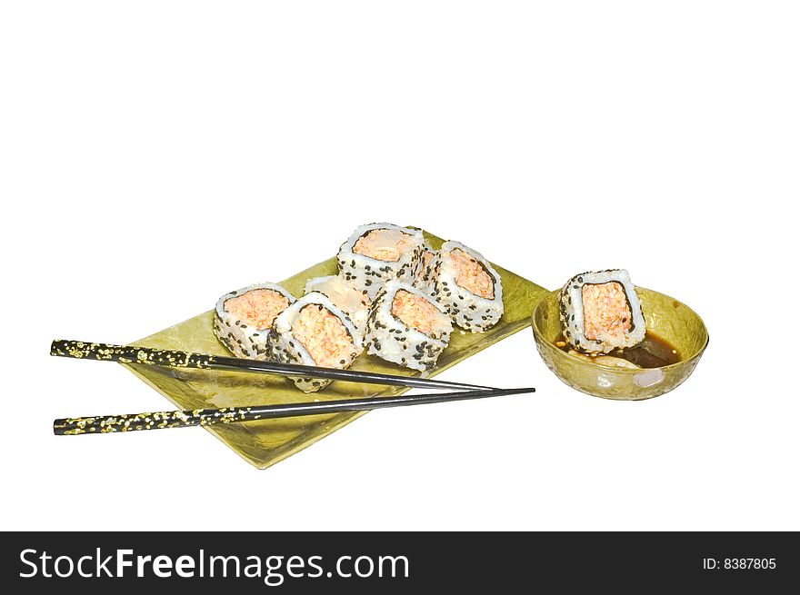 Sushi roll and chopsticks isolated on white background