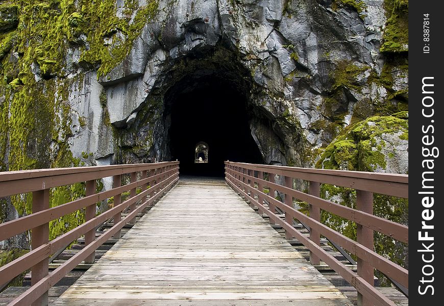 A bridge provides the entry way to a series of old railroad tunnels near Hope, BC Canada. A bridge provides the entry way to a series of old railroad tunnels near Hope, BC Canada