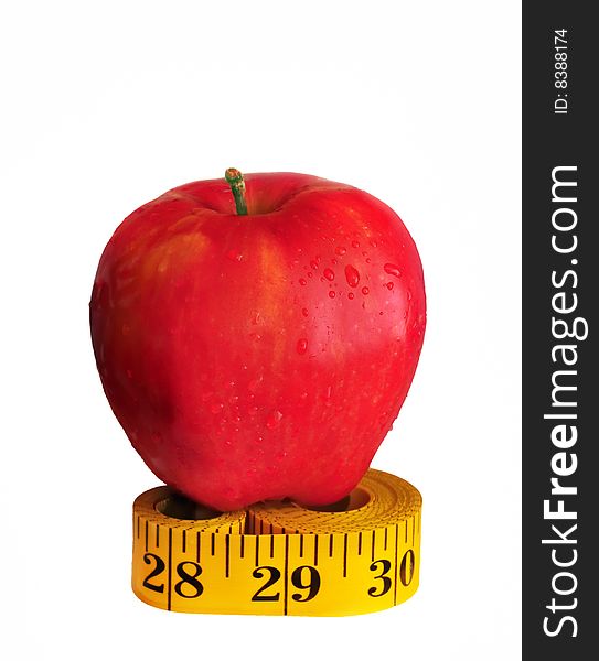 Depicted is a red apple on the measuring tape - isolated over white. Depicted is a red apple on the measuring tape - isolated over white