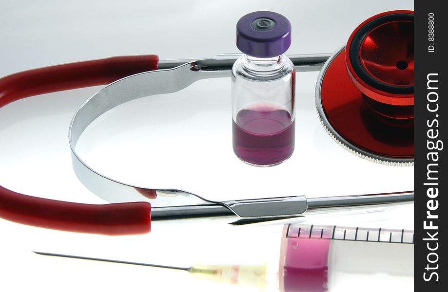 Syringe, medication an red stethoskop. Syringe, medication an red stethoskop