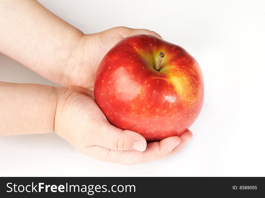 Fresh red apple on hands isolated on white background