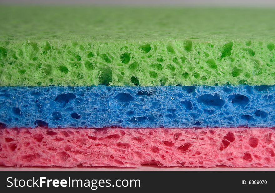 Close-up of 3 multicolor sponges for cleaning