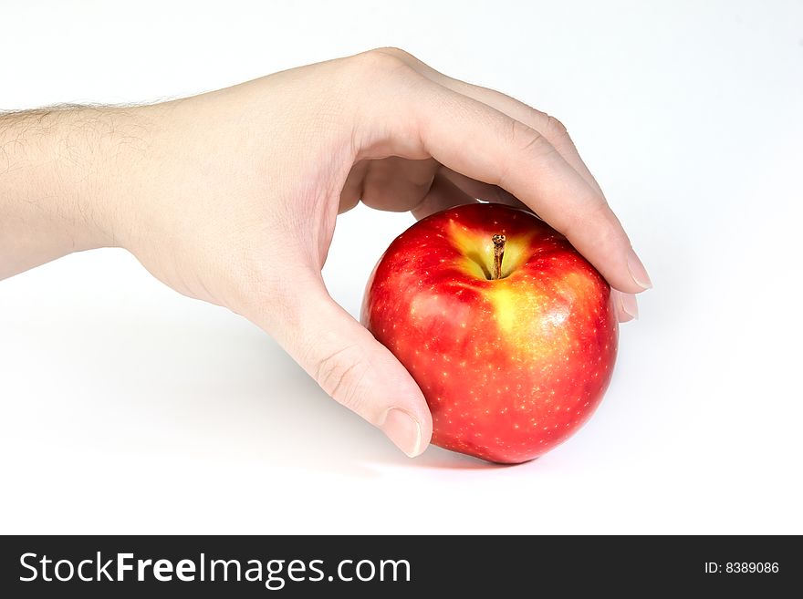 Fresh red apple in hand isolated on white background. Fresh red apple in hand isolated on white background