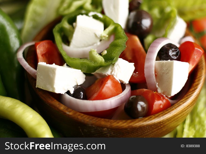 Different positions shots for one wooden plate of salad. Different positions shots for one wooden plate of salad