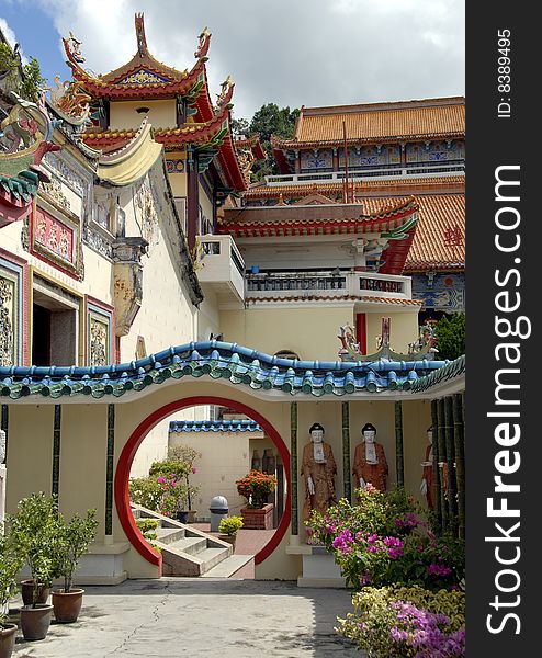 Beautiful doorway and sculptures of Buddha in an asian Temple