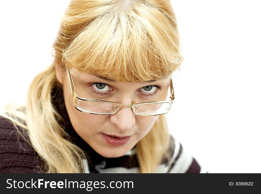 Business woman looking from under glasses