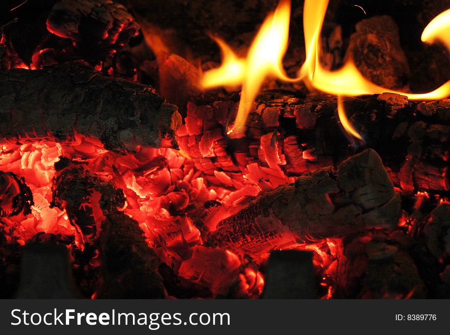 Flames of fire in the fireplace. Flames of fire in the fireplace