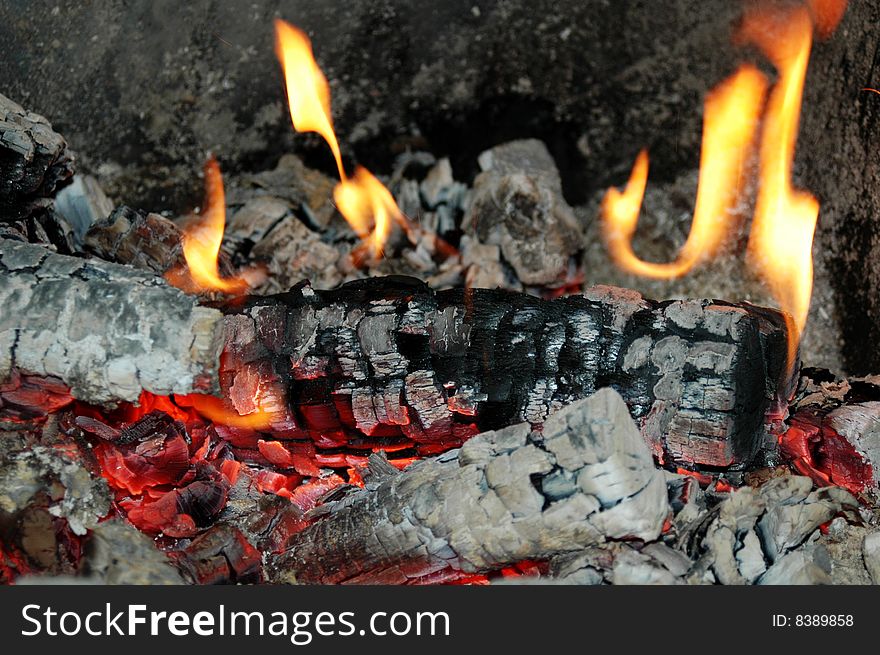 Flames of fire in the fireplace. Flames of fire in the fireplace