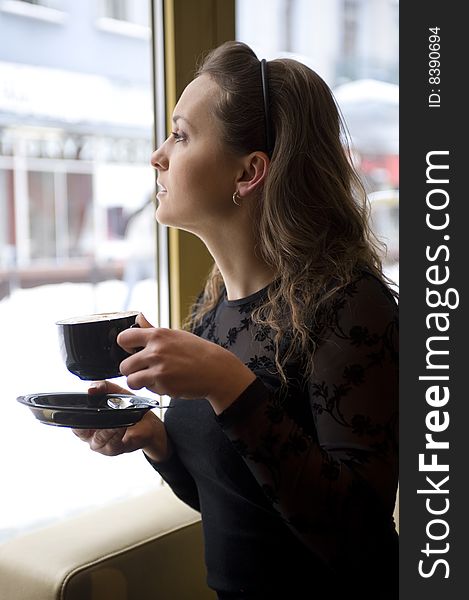 Woman with the cup of the coffee. Woman with the cup of the coffee