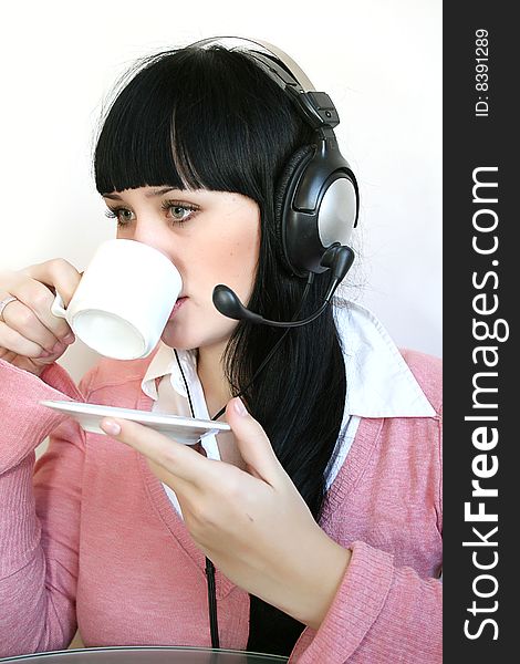 Business customer support operator woman with a cup of hot drink