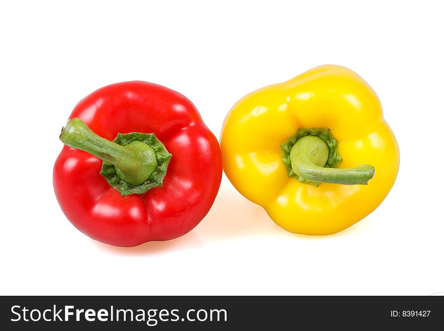 Two fresh peppers on white background