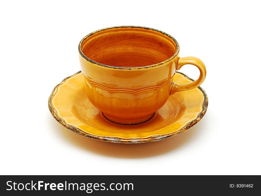 Orange cup with plate isolated on white