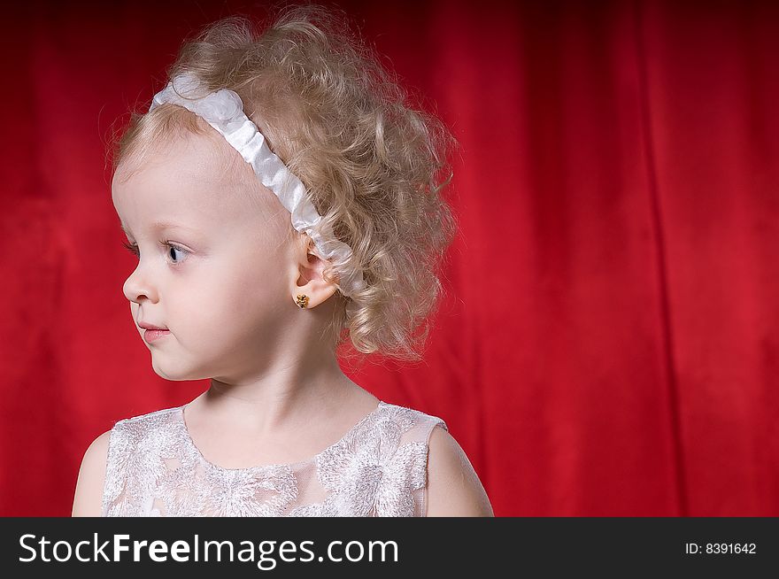 Cute little girl in  a white dress