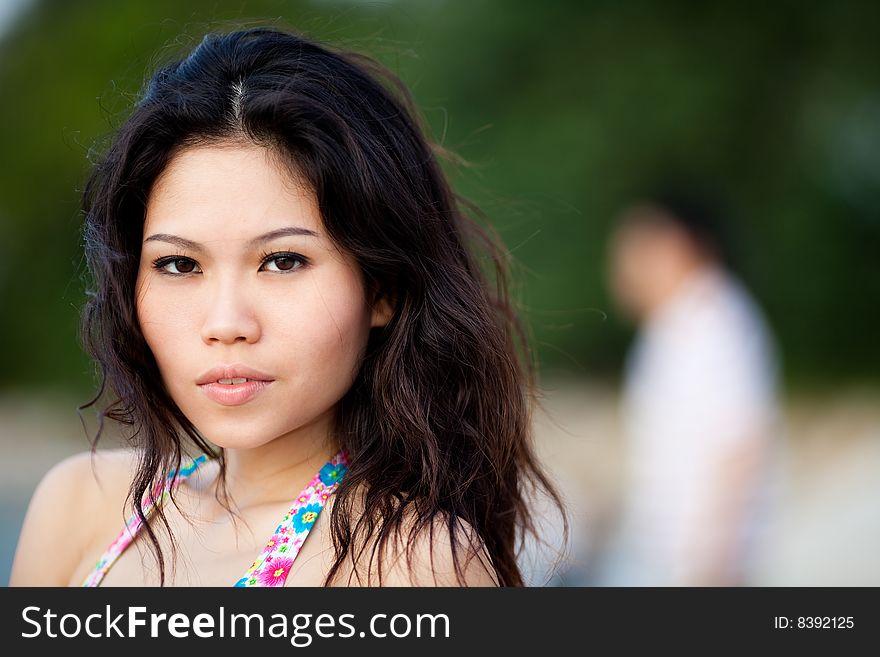 Young woman relaxing by the summer beach. Young woman relaxing by the summer beach