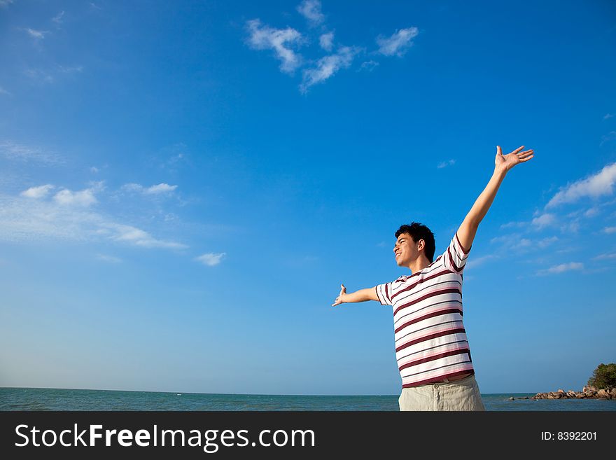 Excited young man having fun at beach. Excited young man having fun at beach