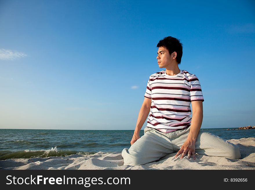 Young man by the beach