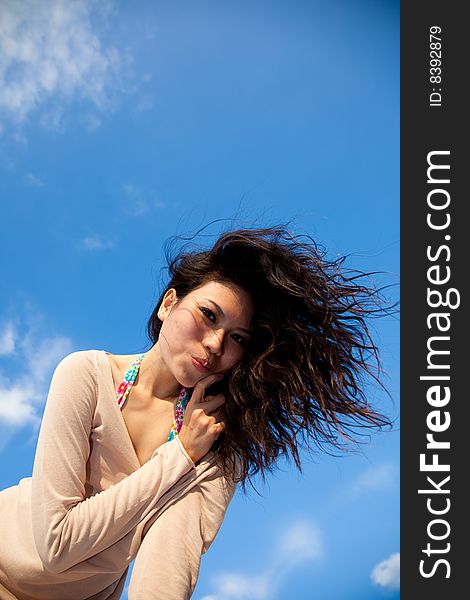 Happy Young Woman With Blue Sky