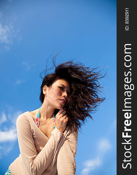 Happy Young Woman With Blue Sky