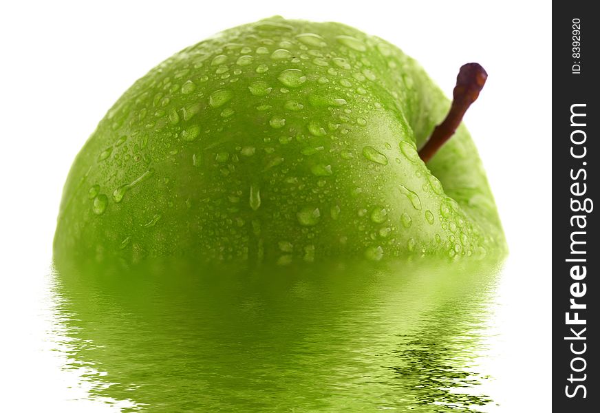 Green apple with water drops and reflection. Very high detail texture.