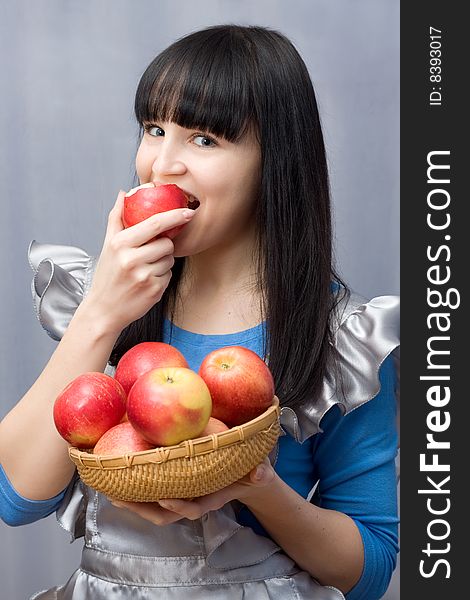 Young Woman Eating An Apple