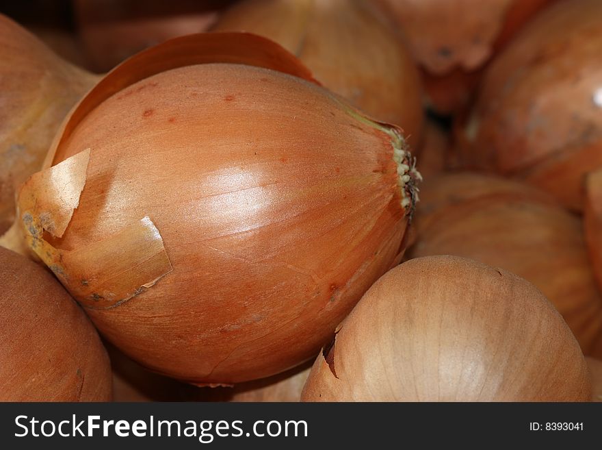 Several onions compounding on the pile